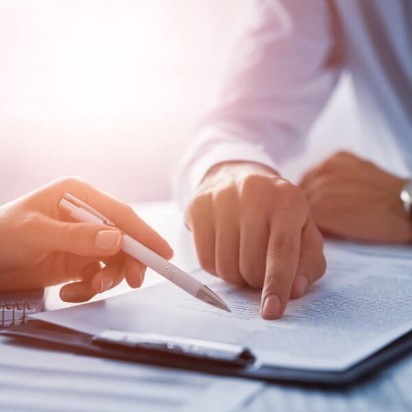 business people looking over contract