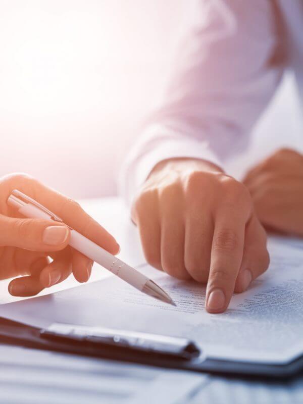 business people looking over contract